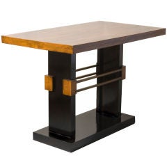 Mid 20th cent walnut top table with an ebonized platform base