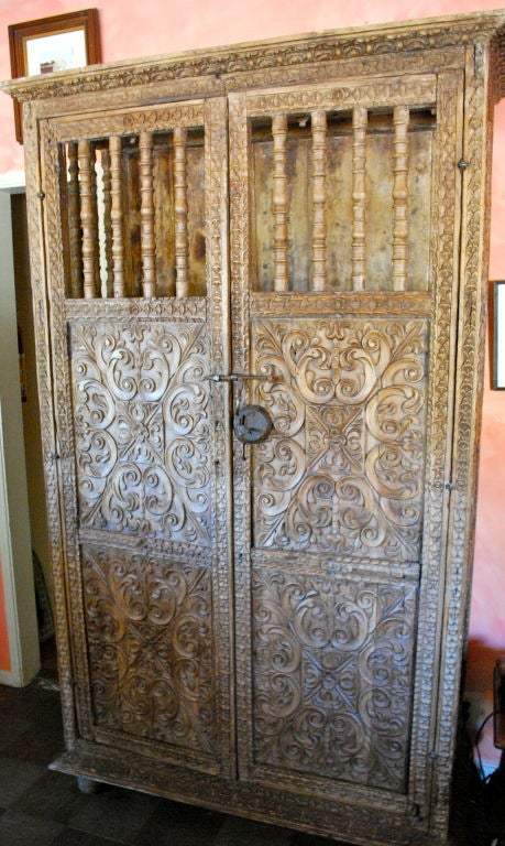 Very beautiful carved Spanish Colonial Armoire with later elements.  Spindle doors and carving throughout the sides. Wrought iron hardware.
















Haskell Antiques-Specializes in rare 16th, 17th, 18th Century Italian,