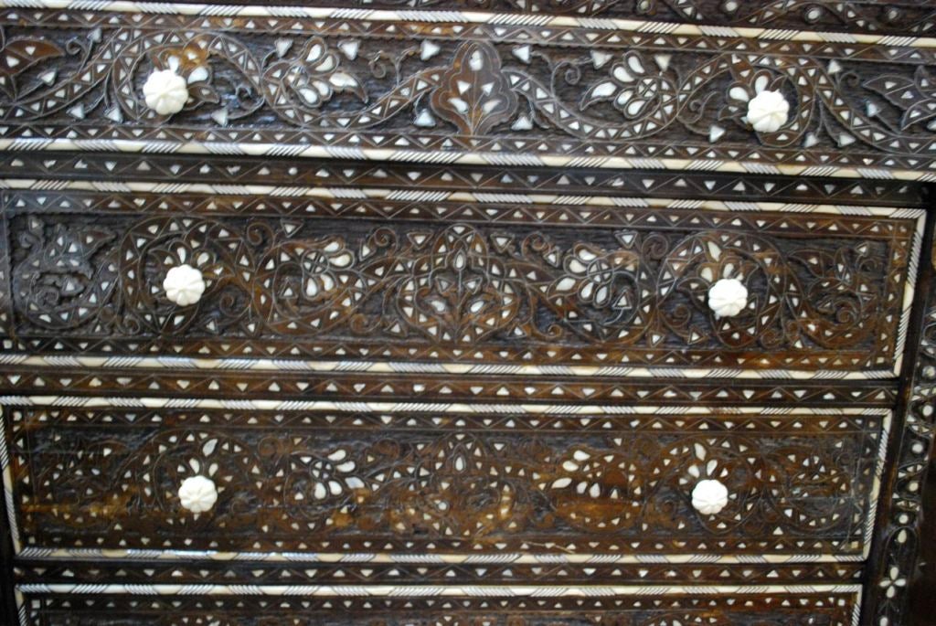 Inlaid Syrian chest of drawers with mother of pearl and wood carving.