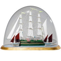 A Glass Model Of A Ship In A Dome