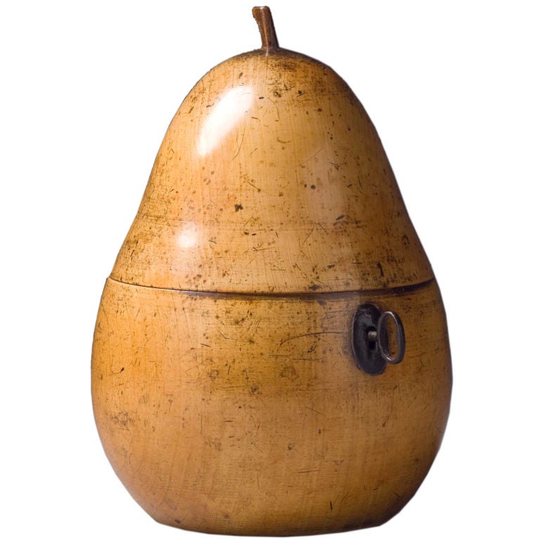 A FRUITWOOD TEA CADDY IN THE FORM OF A PEAR