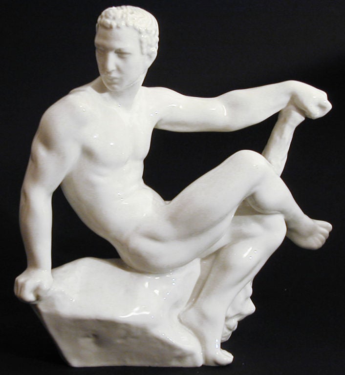 Uncontestably, one of the most sensuous pieces of figural porcelain of the 20th century, this piece shows Hercules resting on a rocky promontory, with one arm outstretched and resting on his signature club.  Although it was sculpted by Jens Jakob