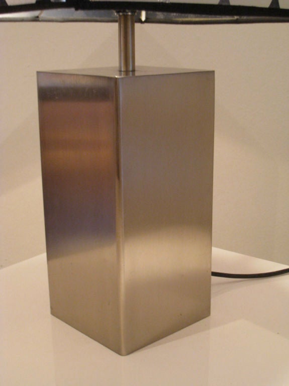 French, 1970s, brushed stainless steel table lamp base, with modern shade<br />
Base: H 24.5 cm / 12 cm sq. - Height including shade: 69.5 cm