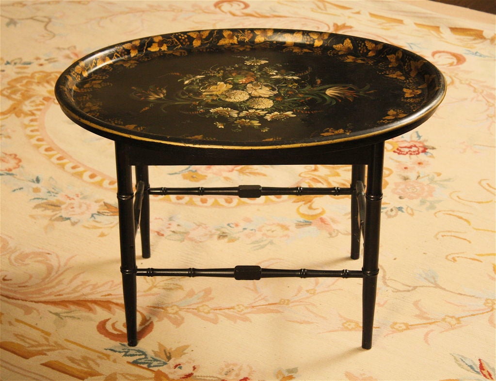 A finely painted and stenciled black lacquered metal tray, on a later matching bamboo turned stand.  The tray rests securely 'in' the stand, and can be lifted out as desired.
Contact Dealer directly for best NET pricing, delivery quotes, and any