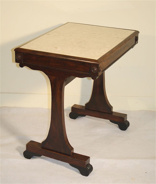 An English rosewood trestle-form side table, of smaller proportion, with its very old or original inset polished marble top for mixing drinks. For sofa, chair or even bedside; or a variety of other special uses where a marble surface is desirable.