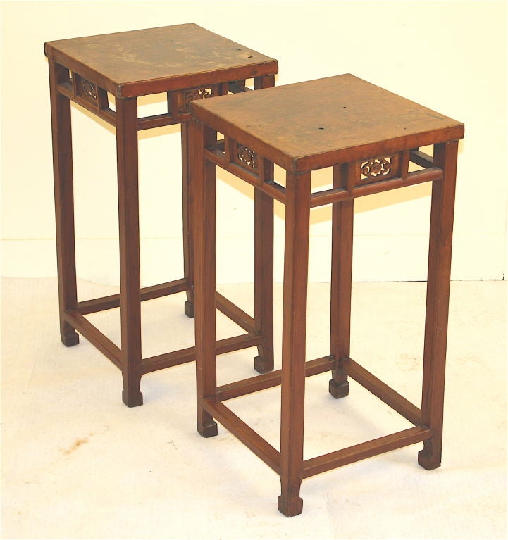 A signed matching square pair of native hardwood leather topped side tables; which may also be used as stands for sculptures, porcelains, lamps or plants. Zhejiang origin; in the Chinese Chippendale-influenced manner, though unlikely made for export.