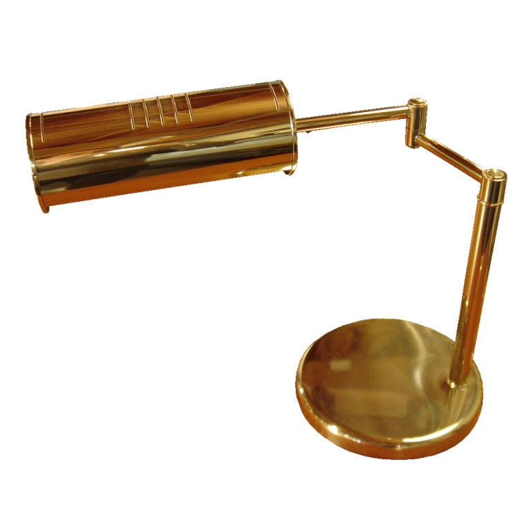 A mid century modern table/desk lamp designed by Walter Von Nessen.  Brass with a fully adjustable swing arm and rotating diffuser for light direction.  We have multiple examples available. please inquire.