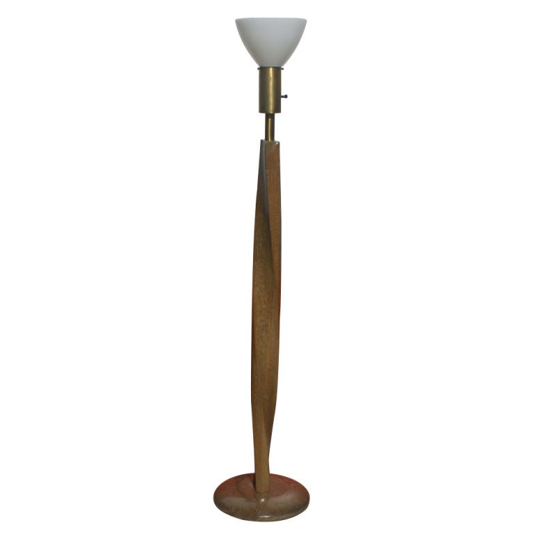 A mid century modern floor lamp in the manner of Sasha Heifetz.  Medium brown oak finish in a spiral form with a vintage brown lampshade.