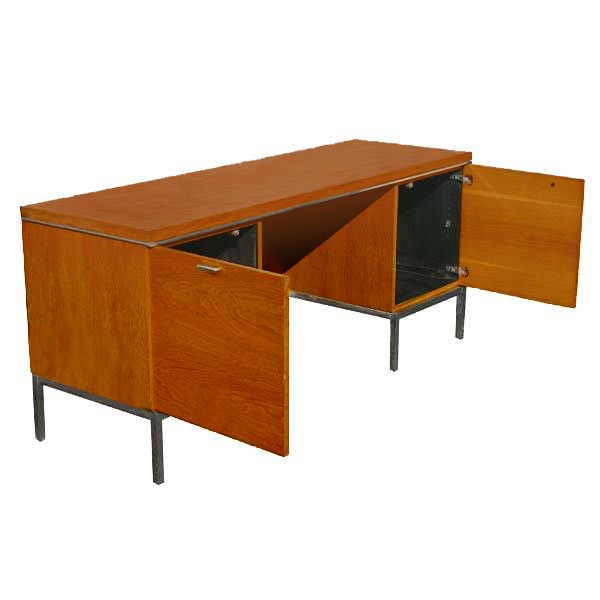 A mid century modern kneehole credenza designed by Richard Schultz for Knoll.  Oak with a chrome frame and legs.  Two doors concealing storage shelves.  As shown in the last picture, we also have a matching desk available on 1stdibs.