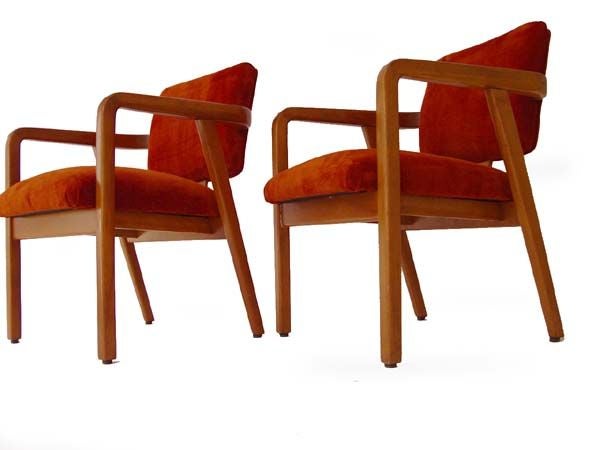 A pair of Mid-Century Modern armchairs designed by George Nelson for Herman Miller. Maple frames with new burnt orange suede upholstery.
