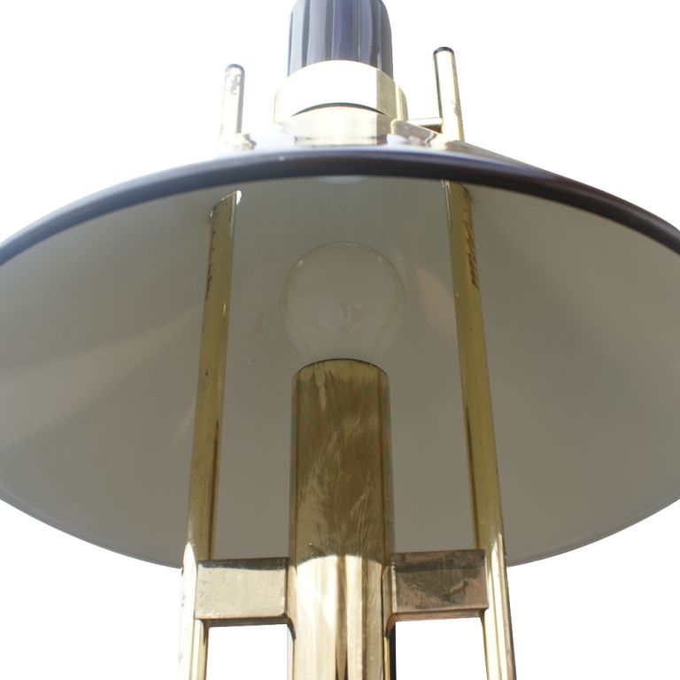 A mid century modern classic table lamp designed and made by Robert Sonneman.  Brass with an adjustable black metal shade and base.