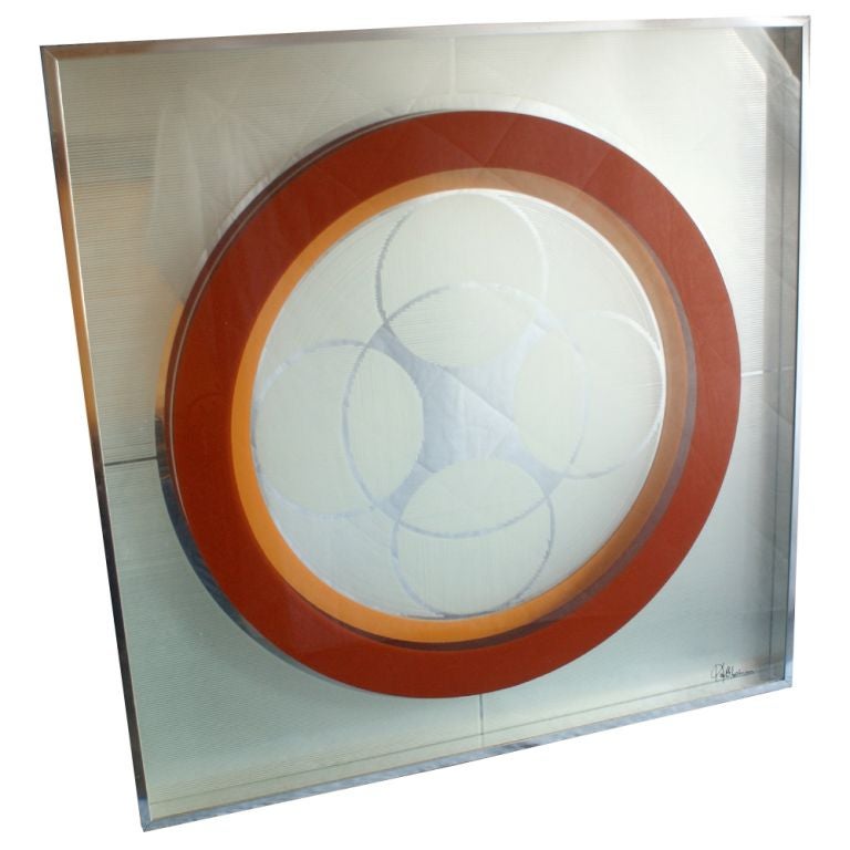 A mid century modern multi-color geometrical print on a mirror framed in an aluminum shadowbox by the studio of George Copeland.