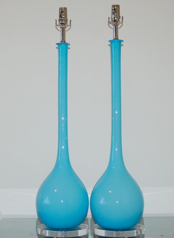 A very simple shape from Archimede Seguso in a VINTAGE T-BIRD BLUE, imported during the 1960s.  A layer of blue glass surrounds an inner layer of white case glass.  

These lamps are a whopping 35 inches to the socket top; the glass alone is