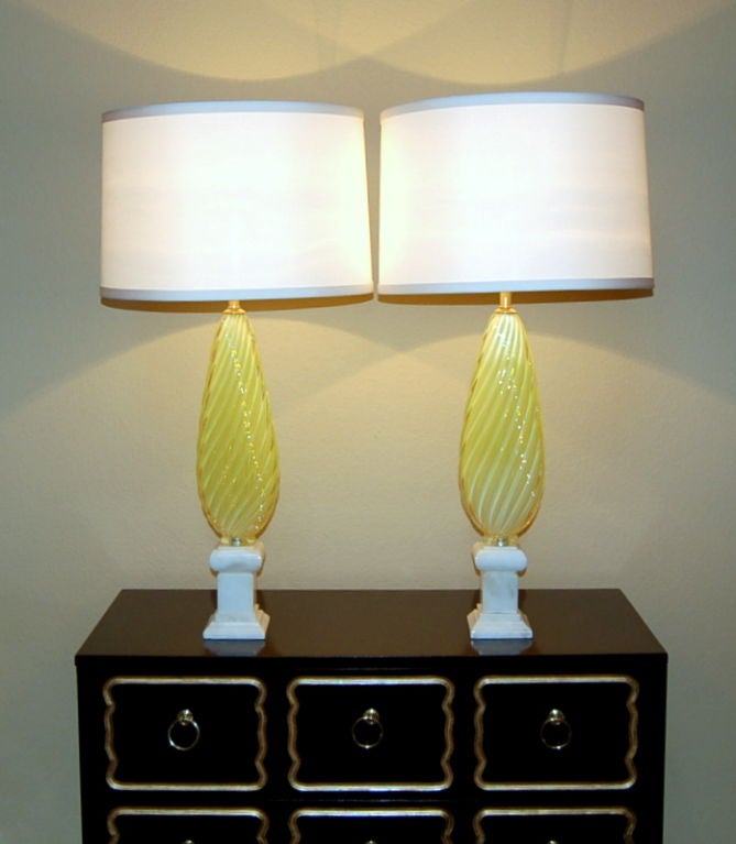 These lemon yellow opaline Murano lamps were blown by Seguso in the 1950s. They are the color of a lemon meringue pie - that wonderful sweet and tart color that, because of the opaline, gets more intense when the sunlight hits it. <br />
<br
