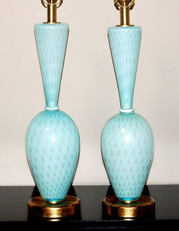 These breathtaking lamps were blown in the 1950s.  The glass is a soft and rich ROBIN'S EGG BLUE wit large controlled bubbles surrounded by GOLD.  The pattern and detail are incredible - it's hard to believe that these were hand blown!

They stand