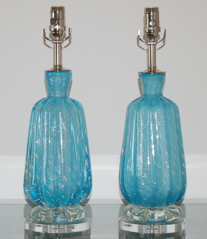 Vintage Murano lamps such as these were commonly seen at bedside or vanity back in the day. What sets these part is color and it's as beautiful as it is rare, a PAUL NEWMAN BLUE.

The lamps stand 18 inches to the top of the socket. As shown, the
