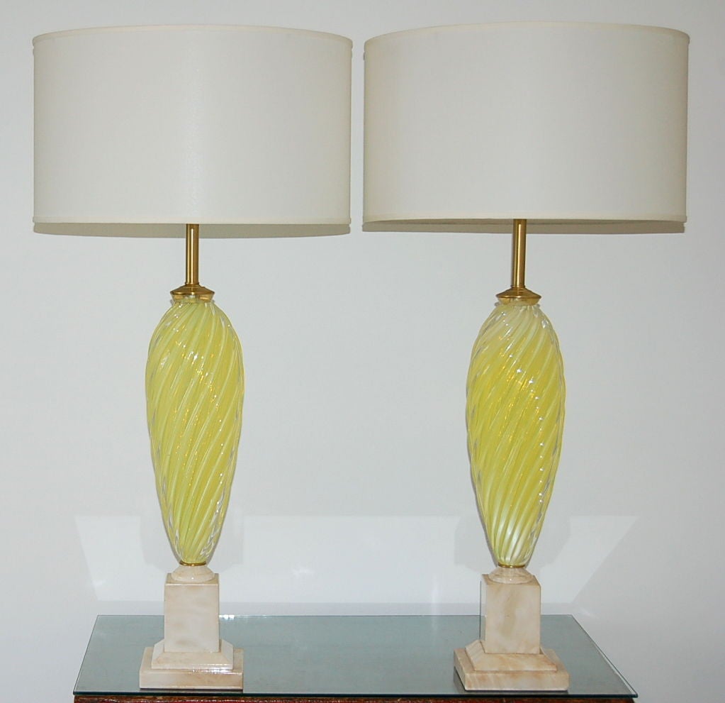 Blown by Seguso in the 1950s, these statuesque lamps are the color of a LEMON MERINGUE PIE - that wonderful sweet and tart color that, because of the opaline, gets more intense when the sunlight hits it. 

They stand 27 inches to the socket top.