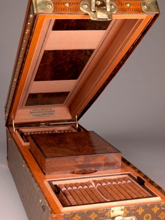 Louis Vuitton Paris: An exceptional cigar humidor of majestic proportions, professionally adapted from a rare ‘Encyclopaedia Britannica’ trunk c.1925, incorporating cabinet storage for around 500 cigars, together with a removable humidor in figured