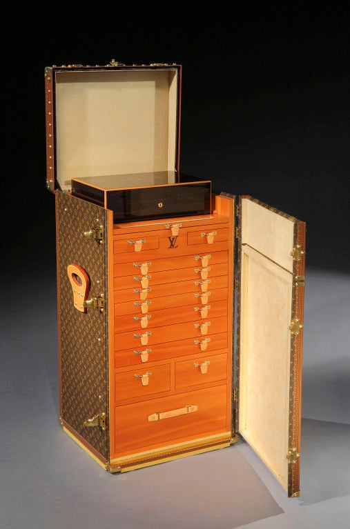 Louis Vuitton, Paris: a magnificent ‘Malle Cigares’, model number M11040, based on the 1926 ‘Stowkowski’ trunk. The hinged doors open to reveal a superb marquetry-inlaid removeable humidor (16 x 12 x 5 inches) and a fully fitted interior, comprising