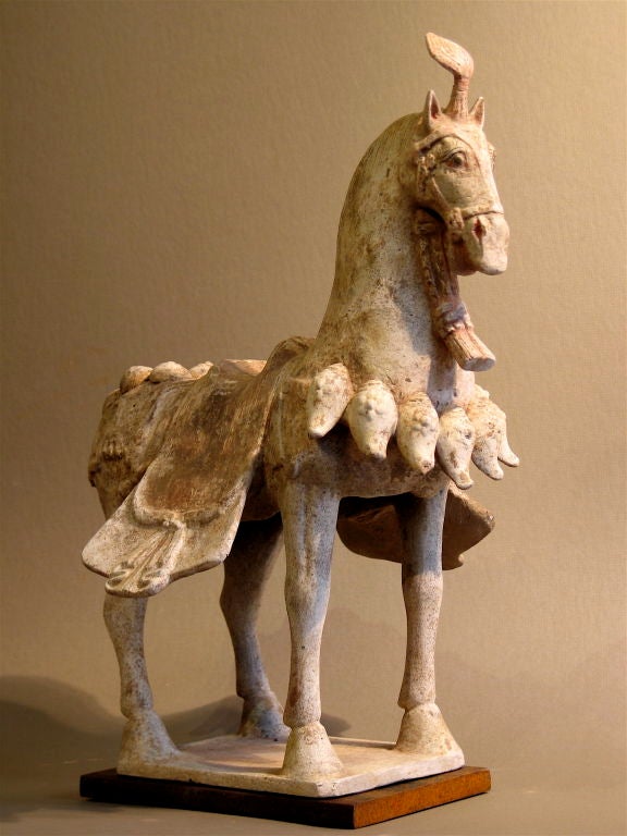 A pottery horse from the Northern Chi Period. 9550-577 A.D.0