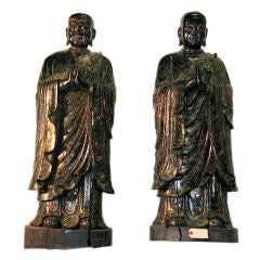 Pair of large wood sculpture of Budhist monks.