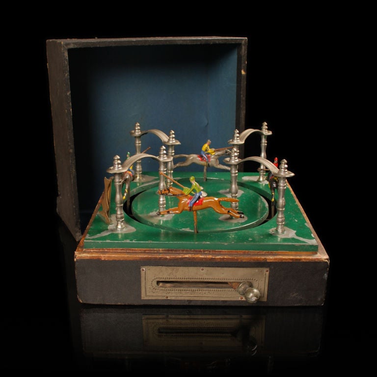 This is a spectacular mechanical Horse Racing Game from the 1900's. This vintage game is similar to other French Horse Racing games, except this one has the riders holding what look to be Polo mallets. I've only seen one other Polo race game like