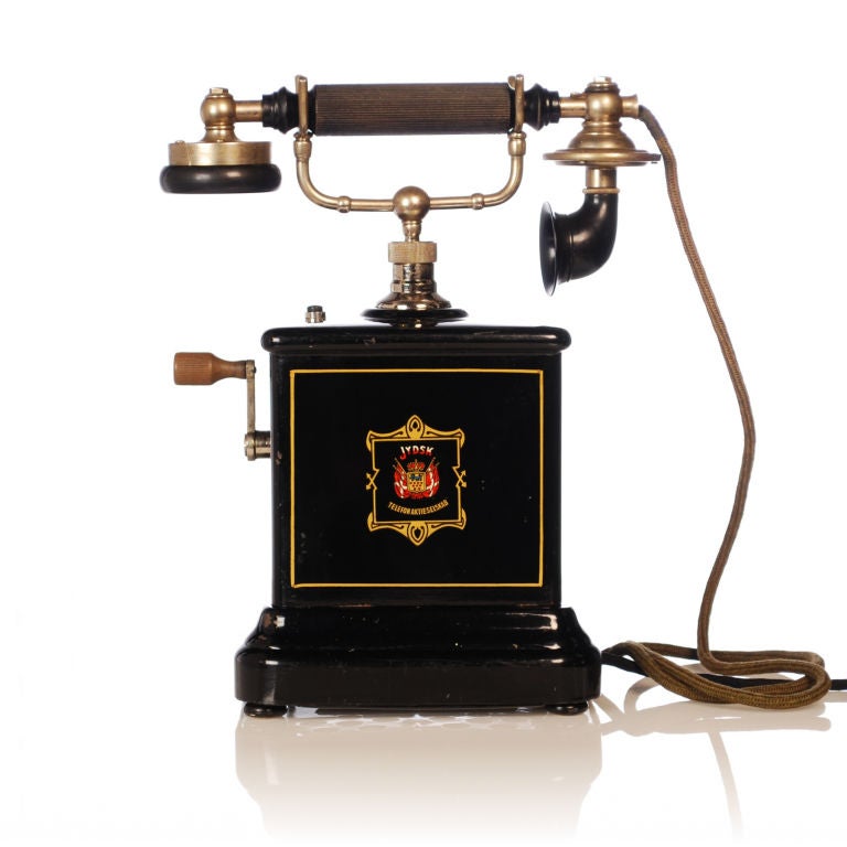 This antique Jydsk Telephone was used by the Danish Jutland Telephone Company in the early 1900's. The gold leaf pin-striping is in excellent condition. The magneto turns easily with the crank handle and the bells ring perfectly. The handset is
