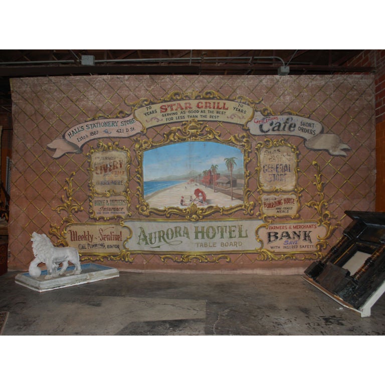 This is an authentic Movie Theater Backdrop from the mid 1900's. Just like the old Vaudeville Backdrops, this large canvas banner features advertising from the local retail merchants. Extremely well painted this piece was produced by Grosh & Company