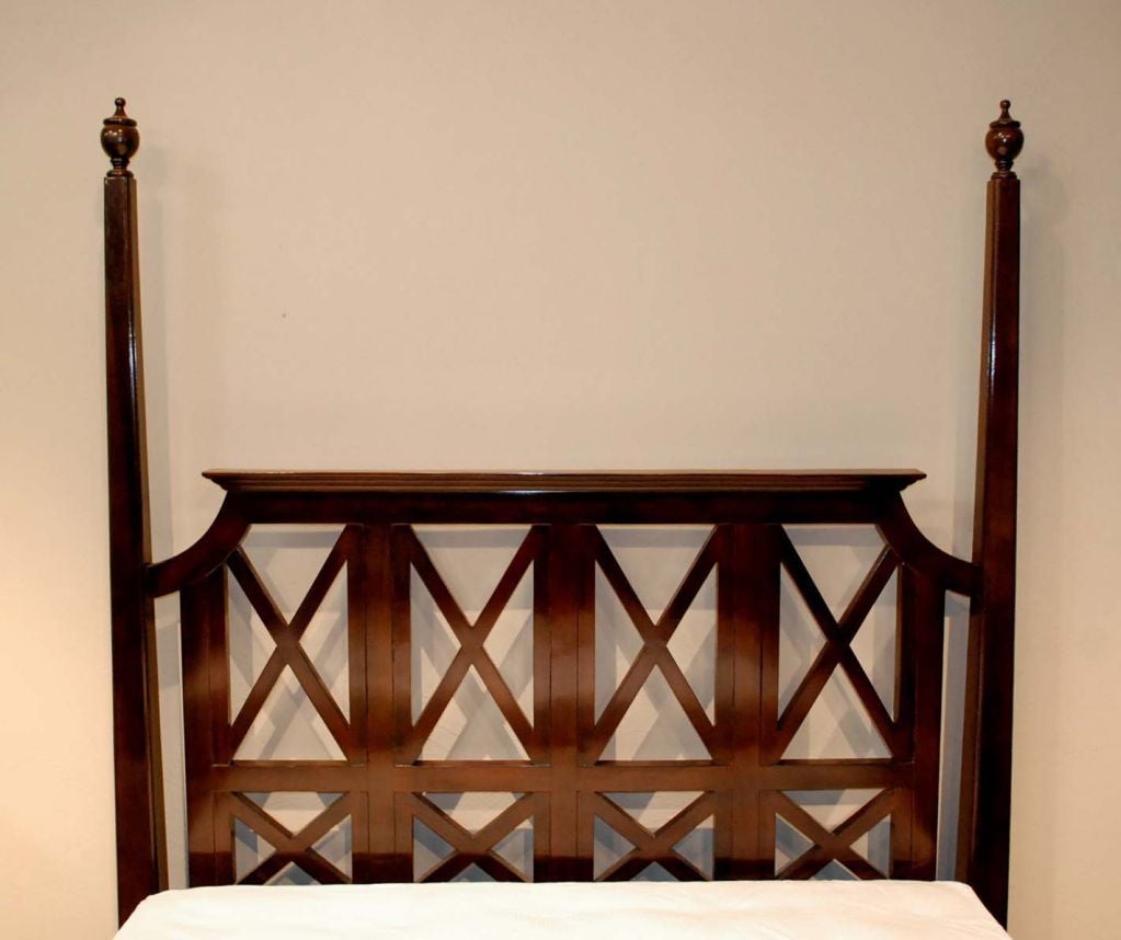 An Empire bed in queen-size, (king also available) headboard and footboard with a crisscross pattern, four tapered posts ending in bracket feet and finials.
