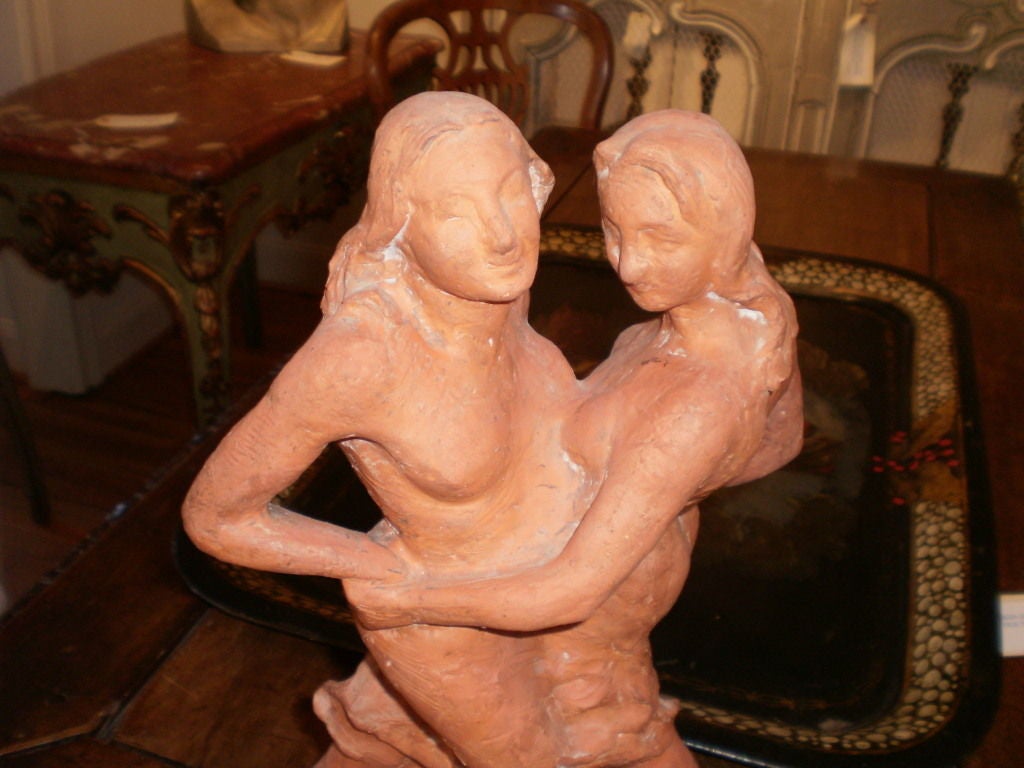 Well executed antique French terracotta figurative sculpture signed T. Foris (1921). This gorgeous French terra cotta figurative sculpture depicts two dancing maidens.

.