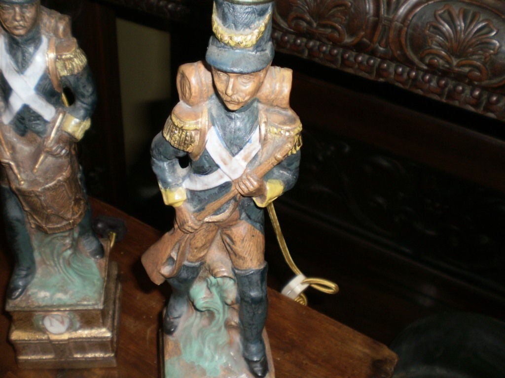 Pair of French Porcelain Soldier Lamps In Good Condition In Houston, TX