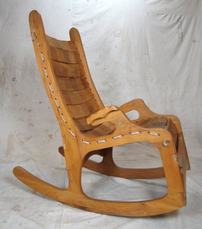 Craftsman made rocker with wooden blocks on nylon rope forming the comfortable seat