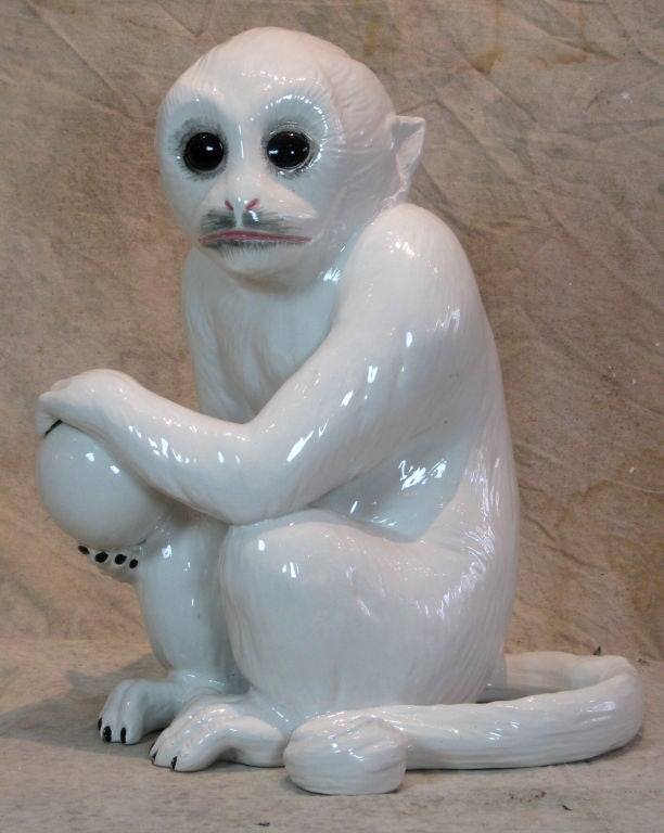 Whimsical Life Size White Glazed Ceramic Sculpture of A Monkey Holding a Ball