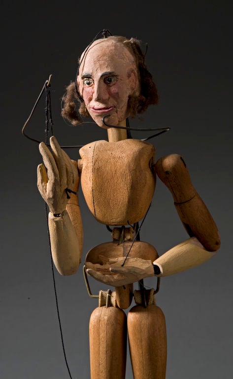 A Pair of Male Marionettes<br />
Anonymous maker.<br />
Jointed wood with wire.  Hand painted faces with fiber hair.<br />
Lead applied to feet used for tapping. Hand made.