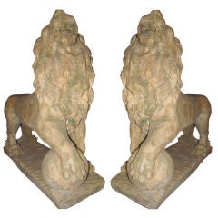 Pair of cast stone lions