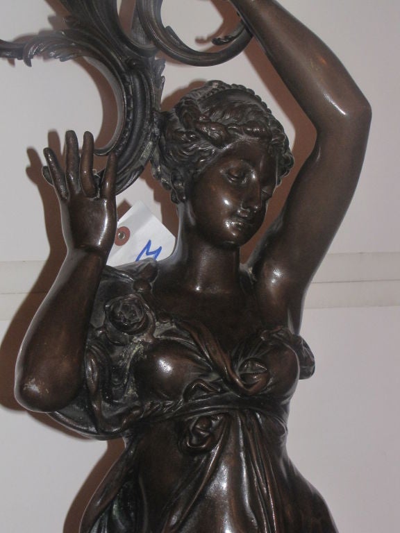 Large Art Nouveau figural bronzed two light lamp in the manner of Auguste Moreau.