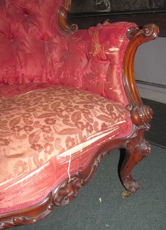 Late Victorian carved walnut sofa.