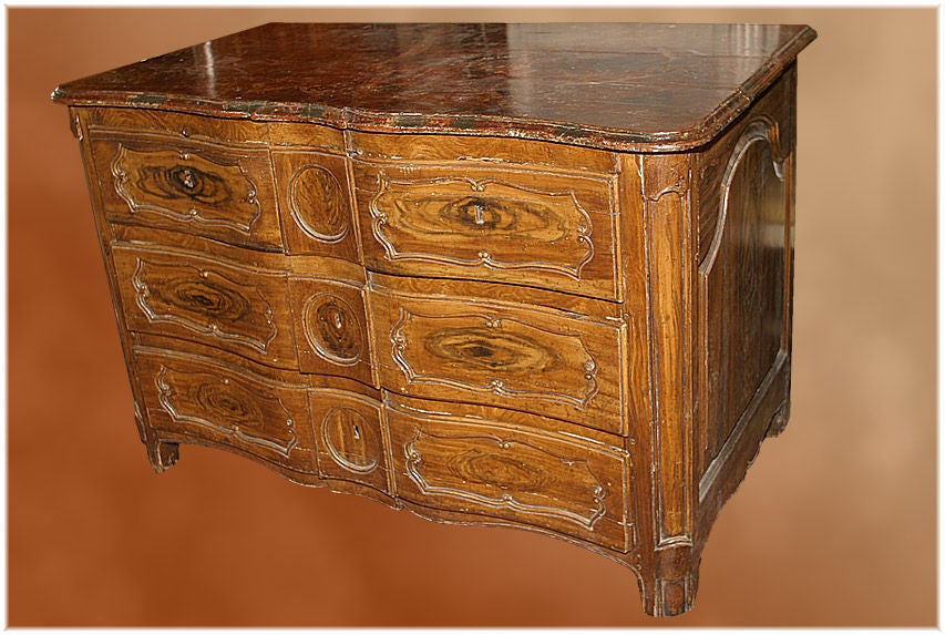 Early and rare 18th century French Louis XIV style faux bois commode with faux marble top with four drawers, circa 1730.

Measures: H 33", W 51", D 27½".