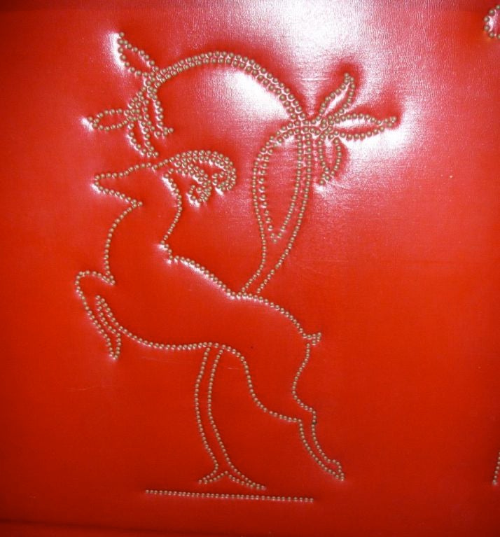 Here is a Classic you don't see everyday. A very cool red vinyl Art Deco bar with artistically hand-hammered

nails complete a leaping gazelle, very Art Deco. This is a very usual bar, not too large, it has a nice white vitrolite glass top. The