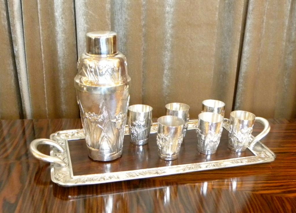 <br />
Here is what I know and I think. During the 1930's some very rare sterling hand made sterling cocktail sets<br />
were made for the American market (I think it is originally from Japan, there are NO maker marks). The set is of course marked