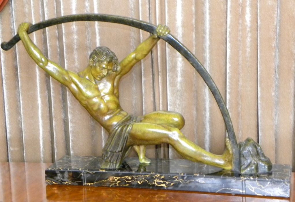 Bending Bar Man by Chiparus , This powerful French spelter statue by Demetre H. CHIPARUS (1888-1950) sometimes referred to as the famous bending bar man (Jeune archer).  It was made in 2 sizes this one much more rare,  is the large sizer, 34'W X