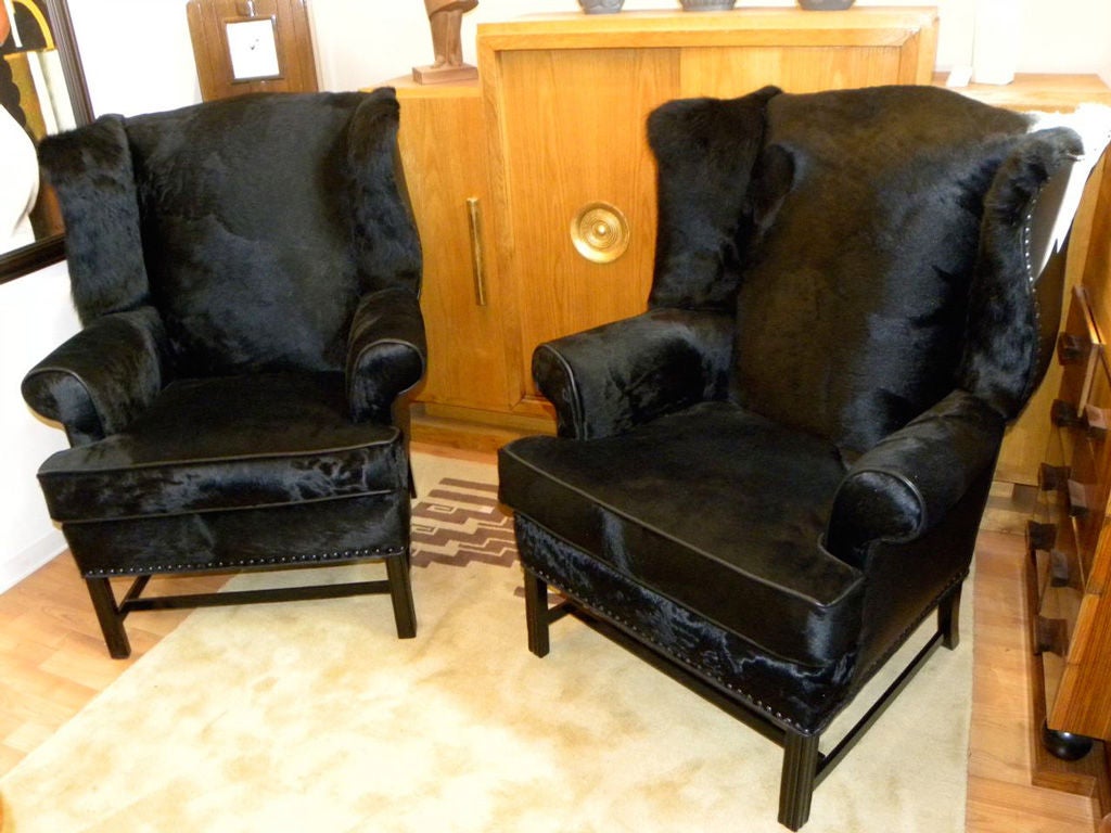 We are offering you a pair of restored wingback chairs like nothing you've seen before.  Originally from the art deco period probably made  circa 1920's, but updated using real 