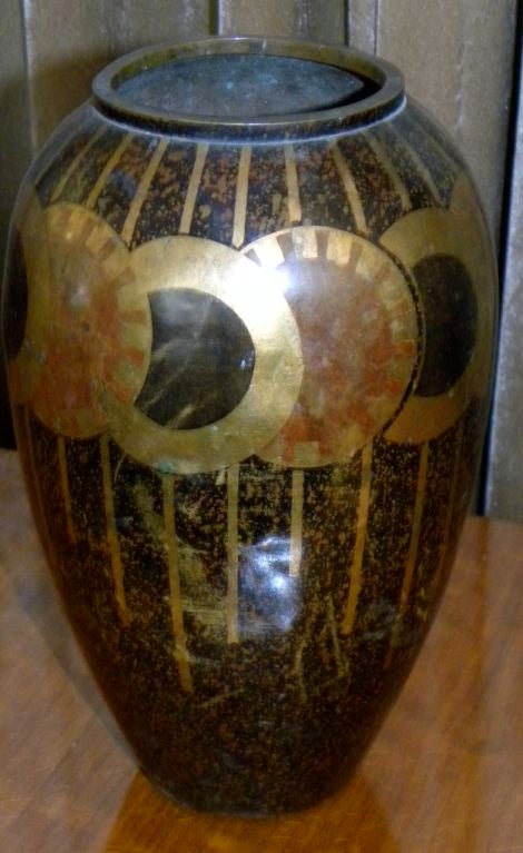 Here is a wonderful dinanderie vase signed and it looks like M. Charles. Made in France circa 1930's. <br />
It is a wonderful design with a  spotted back ground which shows a dominate<br />
art deco spin wheel repeating with intersecting lines. 