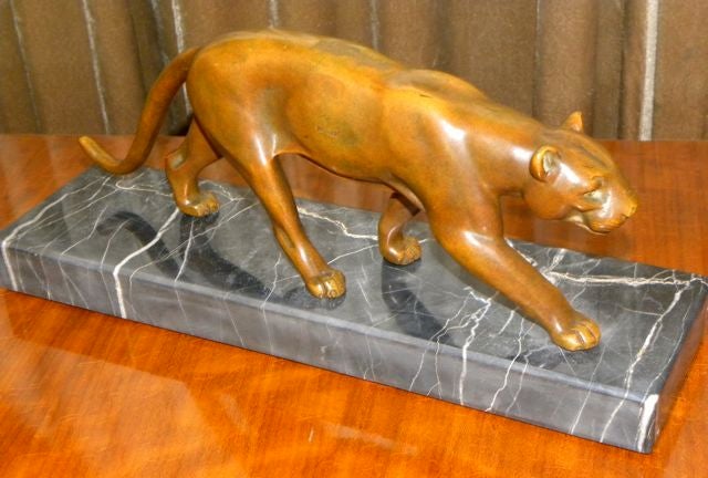 What a wonderful patina on this original French bronze cougar. Warm bronze color stalking on original Italian portoro marble base. A handsome piece ready to walks its way to your home.  No signature but obviously made by someone who understood the