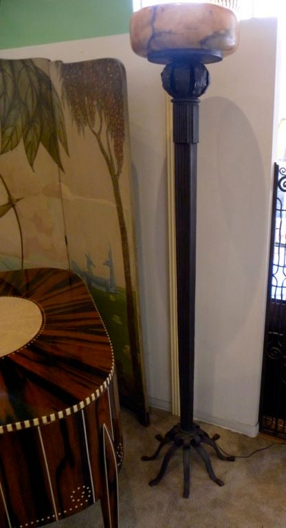 N our continued attempt to acquire some unusual Art Deco pieces, we were fortunate to have this spectacular iron floor lamp/torchier custom-made for our shop. We have been offering some outstanding iron pieces completed in a small work shop in South