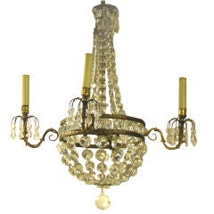 AN EMPIRE STYLE CHANDELIER. FRENCH, CIRCA 1920