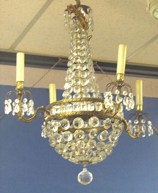 AN EMPIRE STYLE CHANDELIER. FRENCH, CIRCA 1920