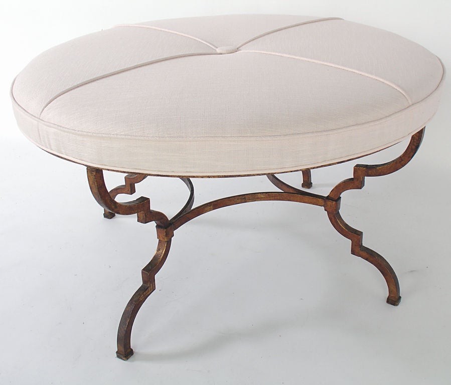 Large Round Bench or Coffee Table with Sculptural Gilt Base, probably Italian, circa 1950's. The gilt metal base retains it's excellent original patina. Reupholstered in an ivory color linen.