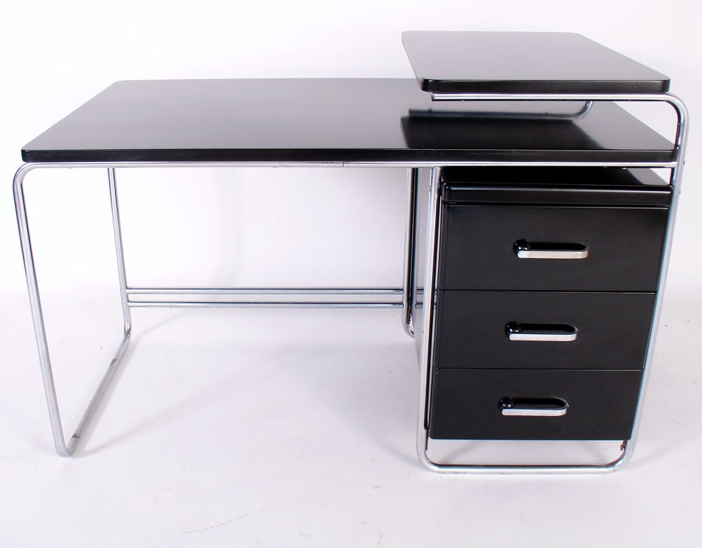 Art Deco Desk, designed by Wolfgang Hoffmann for Howell, circa 1930's. A sleek example of American Art Deco design that shows Wolfgang Hoffmann's European influences. While American, this piece is very similar to the clean, tubular lines of Marcel