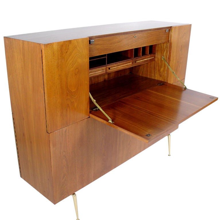 Large Scale Cabinet, designed by T.H. Robsjohn Gibbings for Widdicomb, circa 1950's. This piece offers a voluminous amount of storage, and could function as a room divider(as it is finished and has storage on both sides), or as a secretary, bar,